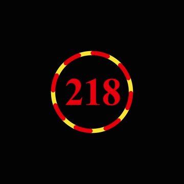 Spinning number two hundred eighteen in poker chip style circle with red and yellow pattern on black background.