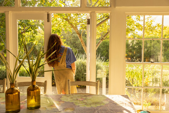 teen girl relaxing, overlooking beautiful garden, Stanford, South Africa