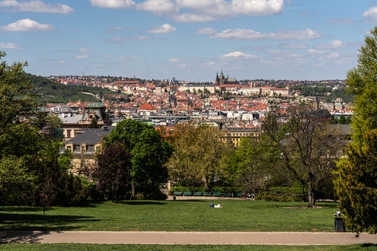 Prague panorama from Riegrovy Sady . People relaxing in the city park on sunny Spring day.