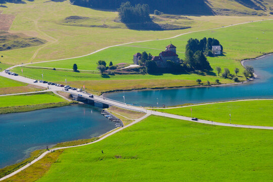 Aerial view of the green area near the Alpine lake and village of Silvaplana. Upper Engadine valley, Canton of Graub&uuml;nden (Grisons), Switzerland