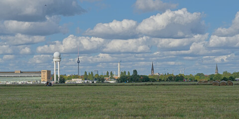 . view on a radar tower, television tower and churches of Berlin from a field in Tempelhof, old airport turned into a city park. Berlin, Germany  © Kristof Lauwers