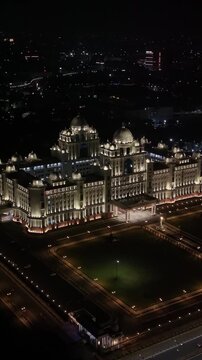 Aerial night & vertical shot of Secretariat of Telangana in Hyderabad, India