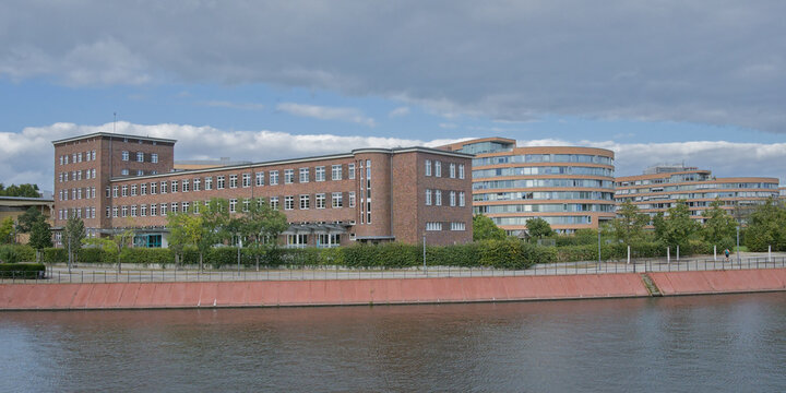 Building in brick expressionism architectural style along Spree river in the city of Berlin, Germany 