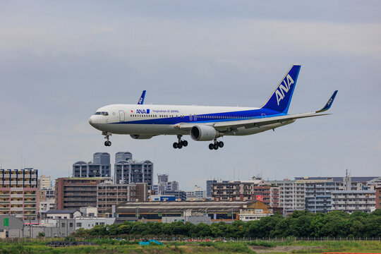 Fukuoka Japan - 2022 July 22: An All Nippon Airways (ANA) Boeing 767-300ER (JA623A) flying low over the runway just before landing at Fukuoka Airport.