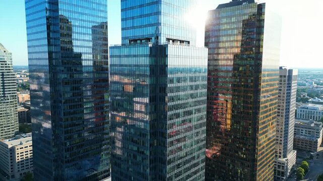 Glass Skyscrapers Reflecting Sunlight - A striking architectural view showcasing colorful glass skyscrapers with bold geometric lines.