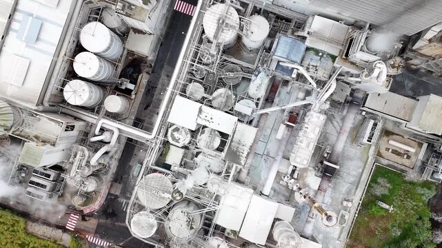 Aerial top view of industrial pulp mill processing plant