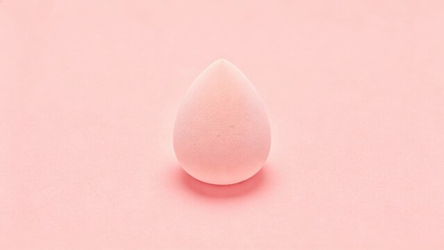 Flat pink cosmetic sponge texture