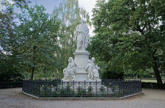 Marble statue of writer and statesman Johann Wolfgang vo Goethe in Tiergarten park, Berlin, Germany. On the foot allegorical figures of Drama, Lyric Poetry (and Amor), and Science 