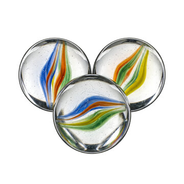 Isolated three glass cat eye marbles with colorful swirls for childhood games and nostalgia concepts