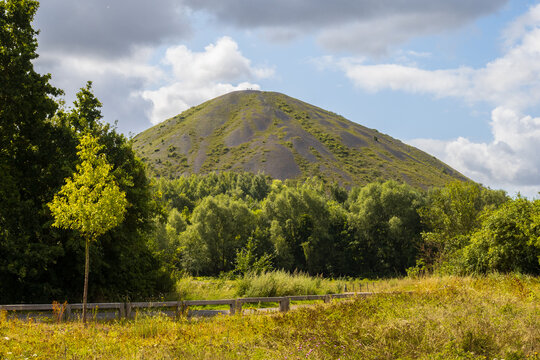 Slag heap of Hauts-de-France Mining Basin, hill formed by the mining waste near Cambrai - France