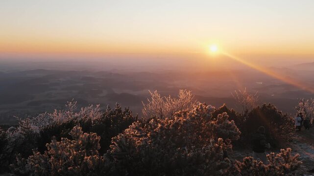 Golden Sunset Over Misty Mountain Landscape and Frosted Shrubs Near Jested Tower in Liberec Czech Republic