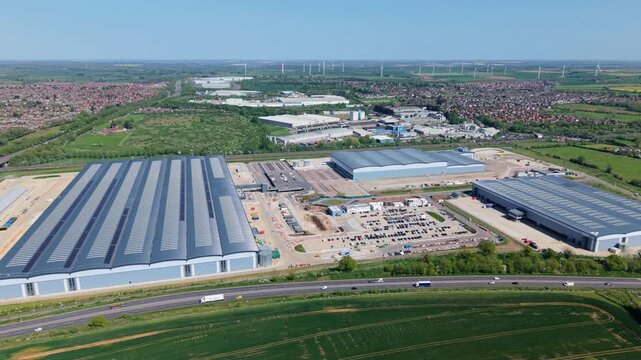 Aerial view of a massive logistics park and mega distribution warehouses, Kettering, UK