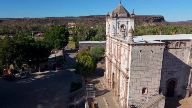 Discover the aerial views of Mission Church in San Ignacio, Baja California, Mexico and enjoy the beauty of this historical site.