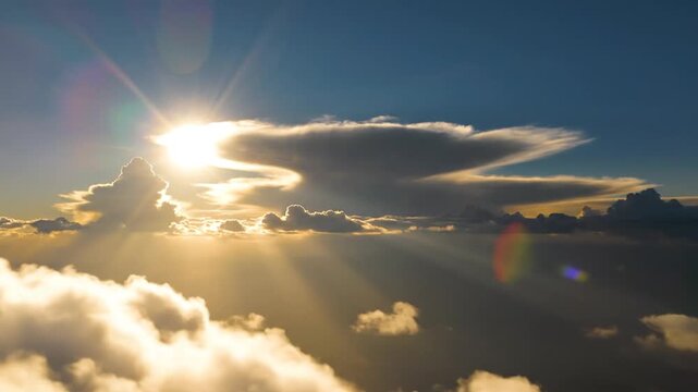Aerial view of bright sun over sea of clouds