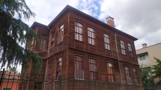 Traditional Ottoman wooden mansion with horizontal timber cladding and multi-pane windows, Edirne, Turkey. Historic residential architecture.