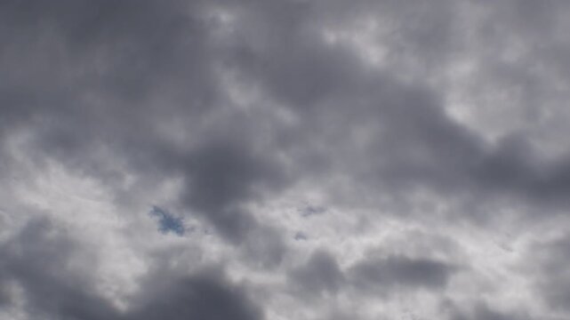 Clouds moving in the sky in a cloudy day.Time Lapse