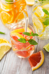 Infused water with fresh citrus fruits and ice © Iuliia Metkalova