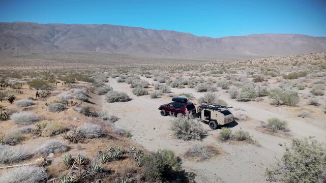 Aerial views show a teardrop camper trailer and SUV exploring trails in Anza Borego Desert State Park and BLM Prune Canyon in California.