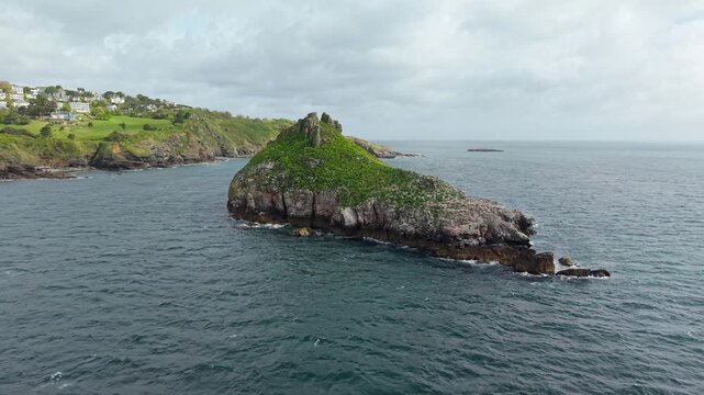 Aerial view of Thatcher Rock, Historical landmark in the United Kingdom. Thatcher Rock is a key sites for studies of Quaternary stratigraphy and sea-level change and forms part of the English Riviera.