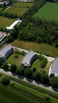 Industrial research buildings equipped with solar panels in Italy. Environmental monitoring and renewable energy infrastructure.