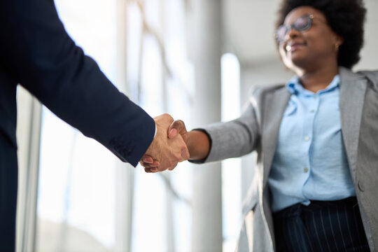 Close up of black businesswoman shaking hands on a meeting in the office