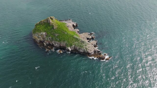 Aerial view of Thatcher Rock, Historical landmark in the United Kingdom. Thatcher Rock is a key sites for studies of Quaternary stratigraphy and sea-level change and forms part of the English Riviera.