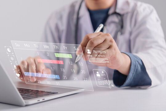 Healthcare specialist working laptop managing virtual consultation schedule screen. Modern doctor organizing patient workflow medicine icons dashboard optimizing modern digital clinic platform.