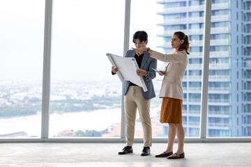 Site Inspection in a High-Rise Building with City View © Washburn