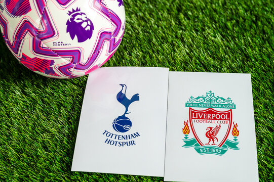 Tottenham Hotspur vs. Liverpool Premier League match, official soccer ball on green grass, wallpaper with edit space.