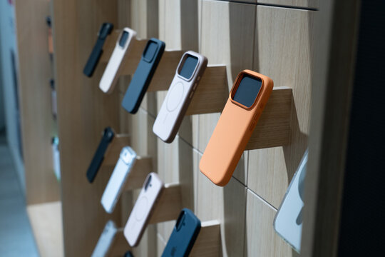 A Display of Modern Phone Cases Showcasing Various Textures, Colors, and Designs in a Retail Space for Smartphone Accessories