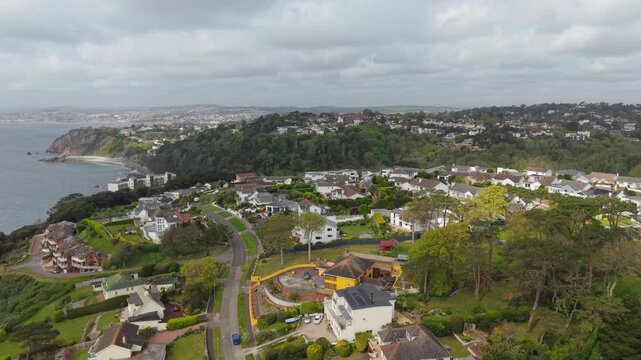 Aerial view of Torquay town. Torquay is a seaside resort town on the English Channel in Devon, south west England. Known for beaches such as Babbacombe and cliffside Oddicombe. Drone POV exploration.