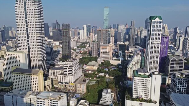 Aerial high view of Bangkok city, urban skyscrapers and office buildings in business district, Thailand, 4k