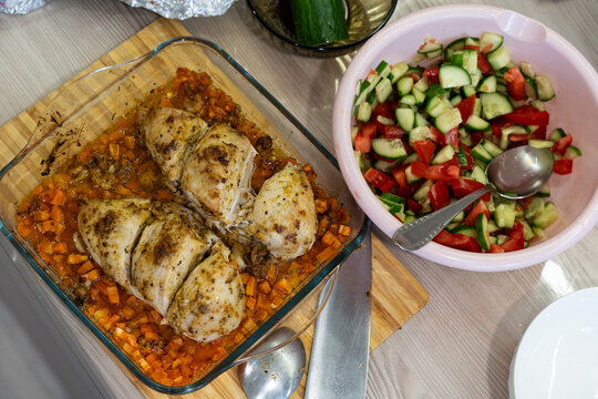 Deliciously Baked Chicken Breast with a Side of Fresh Tomato and Cucumber Salad Overflowing with Flavor and Nutrition