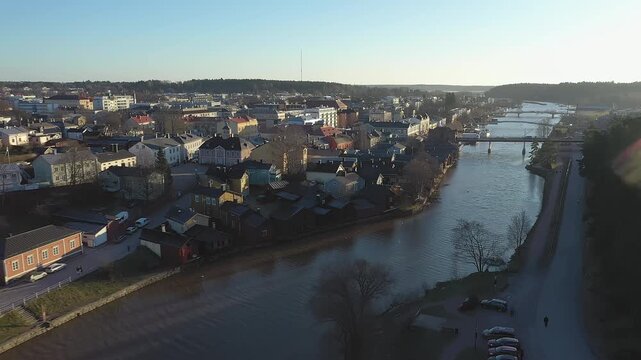 Porvoo.Finland-December 12.2020: Idyllic aerial shot of the Porvoo city and the river in Finland. Aerial shot with the drone moving backwards and upwards.