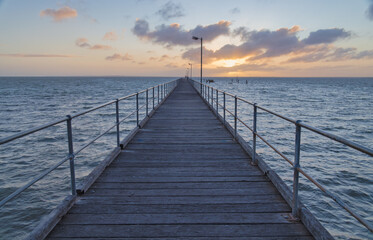 Fototapeta premium Wooden Pier Overlooking the Water at Sunset in Ceduna, Australia