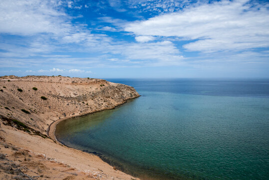 Serene Coastal Cliff and Curved Bay Overlooking Calm Turquoise Ocean Under Blue Sky at Eagle Bluff Lookout, Western Australia, 26 February 2023