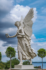 Obraz premium Statue of an angel holding a laurel wreath at Schwerin Castle in Mecklenburg-Western Pomerania, Germany