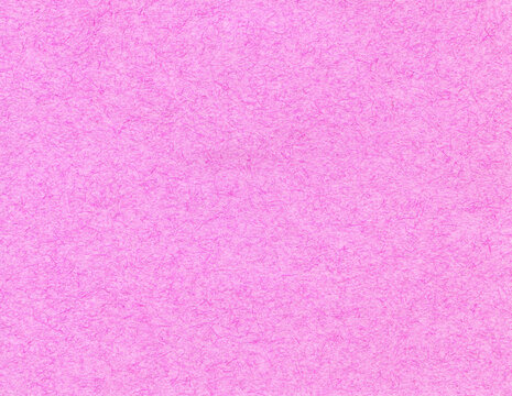 Surface of pink, fibrous paper or cardboard, background, texture. Smooth reddish wall covering, backdrop. Rough, faded, a little bit fibrous pink-colored paper. Fragment of thin, pink paper surface