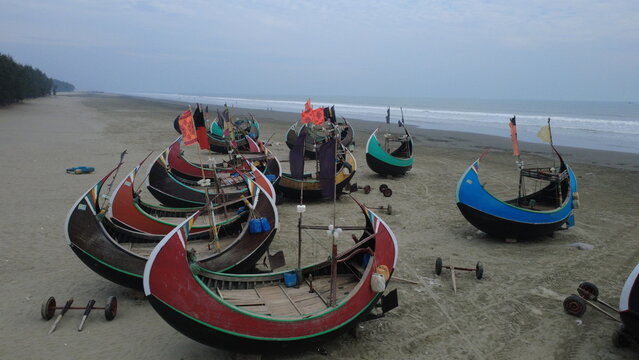 Traditional Wooden Fishermen's fishing boat, Teknaf Coxs bazar, Bangladesh. Colorful Wooden Fishing Boat On a Cox's Bazar Sea Beach With Sunny Day Background in Bangladesh. Beautiful Bangladesh Photo.