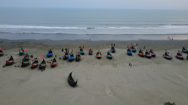 Traditional Wooden Fishermen's fishing boat, Teknaf Coxs bazar, Bangladesh. Colorful Wooden Fishing Boat On a Cox's Bazar Sea Beach With Sunny Day Background in Bangladesh. Beautiful Bangladesh Photo.