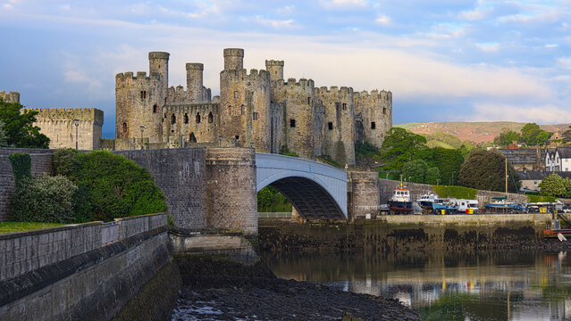 a scenic view of Conwy castle in North Wales There are reflections in the water and space for copy text