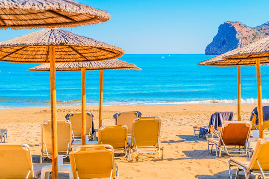 blue chair on Agia Marina beach, Crete Greece, toned
