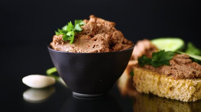 Homemade chicken liver pate with bread and cucumber