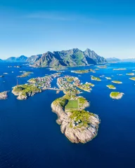 Aerial drone view of Henningsvaer village in Lofoten islands, Norway. Famous view of the football field and the fishing village. Scenic summer travel and arctic nature in Scandinavia. © biletskiyevgeniy