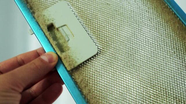 Video of a dirty metal grease filter from a kitchen hood.