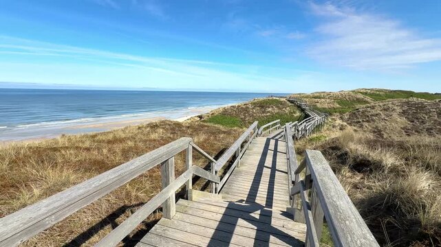 wooden path through the dunes on the island Sylt