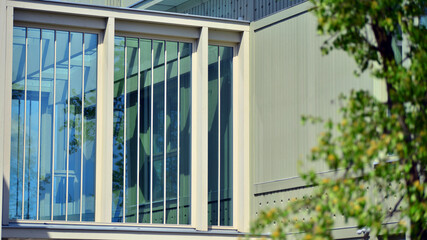 Fototapeta premium A fragment of a low-rise office building in the classical style. Modernity and tradition in office architecture.