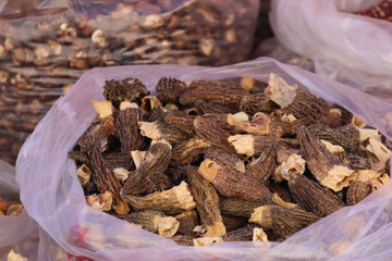 Morel mushrooms for selling in the farmer's market at Songpan Ancient Town, Sichuan Province of China © Crystaltmc