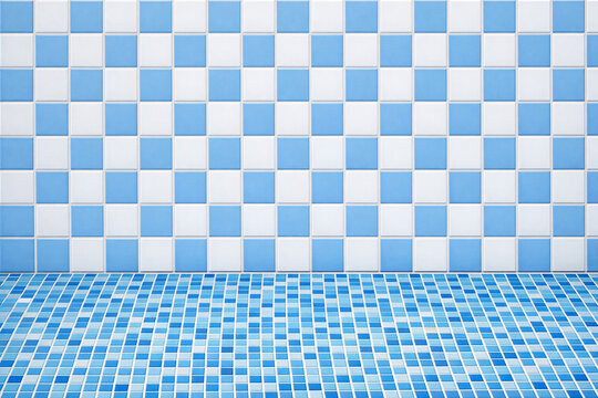 A blue and white checkered tile backsplash with a glossy floor tiles.
