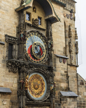 Prague, Czechia - 25 November 2022: View of the Prague Astronomical Clock with its intricate medieval dials and ornate statues on the Old Town Hall facade.
